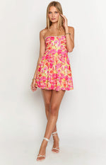 Front view of a yellow and pink floral mini dress with thin straps and pearl trim on the neckline