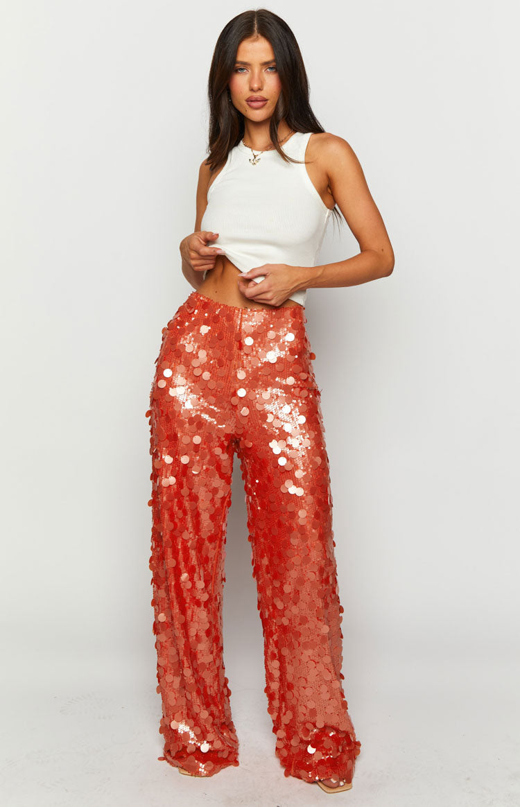 Full length view of orange sequin wide-leg pants with a high waist and all-over round sequins