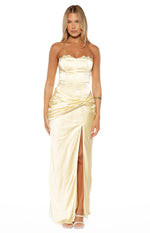 Front view of a yellow satin strapless maxi dress with lace trim neckline, corset bodice, ruched twist waist, and high split