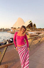 Pink multi stripe maxi skirt with vertical stripes in varying widths of pink, white, and burgundy