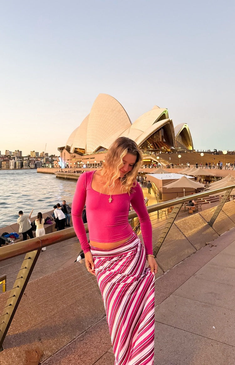 Pink multi stripe maxi skirt with vertical stripes in varying widths of pink, white, and burgundy
