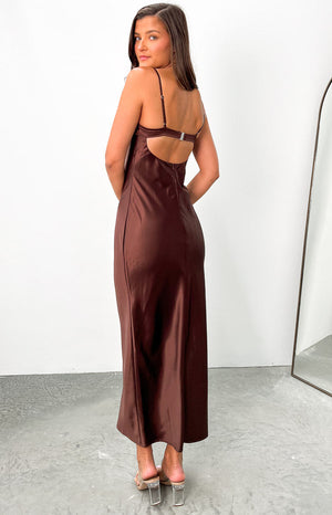 Rear view of a brown satin maxi dress with a low scoop back and adjustable bra-style strap with a silver clasp