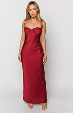 Front view of a scarlette red satin maxi dress with a sweetheart bustier neckline, lace trim, and thin spaghetti straps