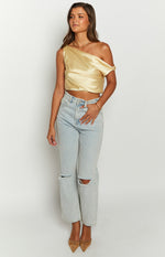 Yellow satin one-shoulder crop top with a draped off-shoulder sleeve and a fitted cropped hem