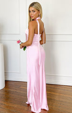 Rear view of a pink satin maxi dress with a scarf neck tie and long flowing back ties
