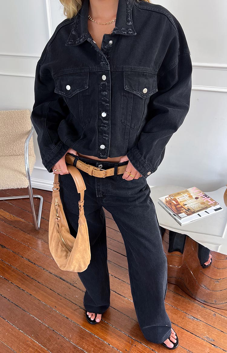 Black wide-leg boyfriend jeans with a relaxed fit, showing the full length and wide hem