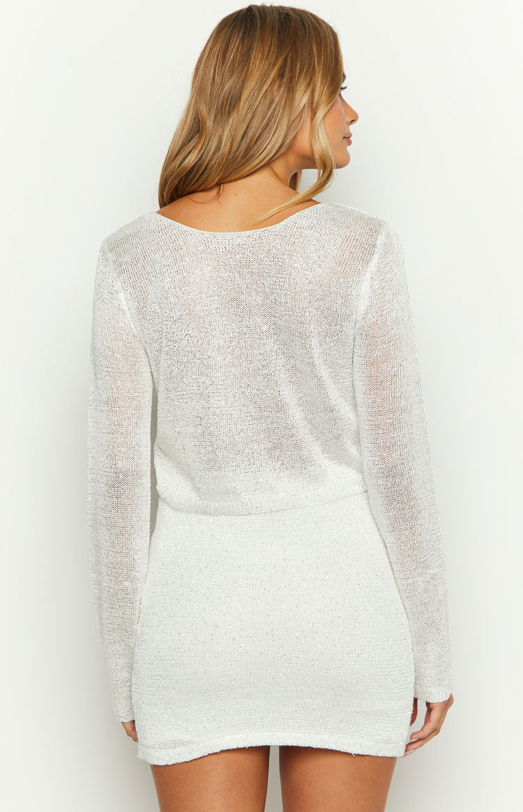 Rear view of the fitted white sequin knit mini skirt with a straight hemline