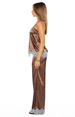 Side view of a brown satin strapless top with a relaxed fit and light blue lace trim along the hem