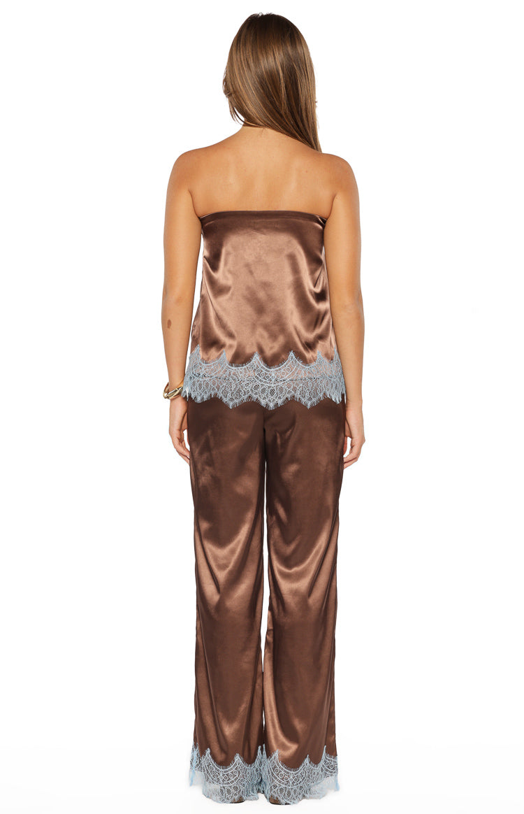 Back view of the brown satin strapless top with a relaxed fit and light blue scalloped lace trim
