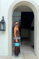 Brown satin strapless top with light blue scalloped lace trim at the hem