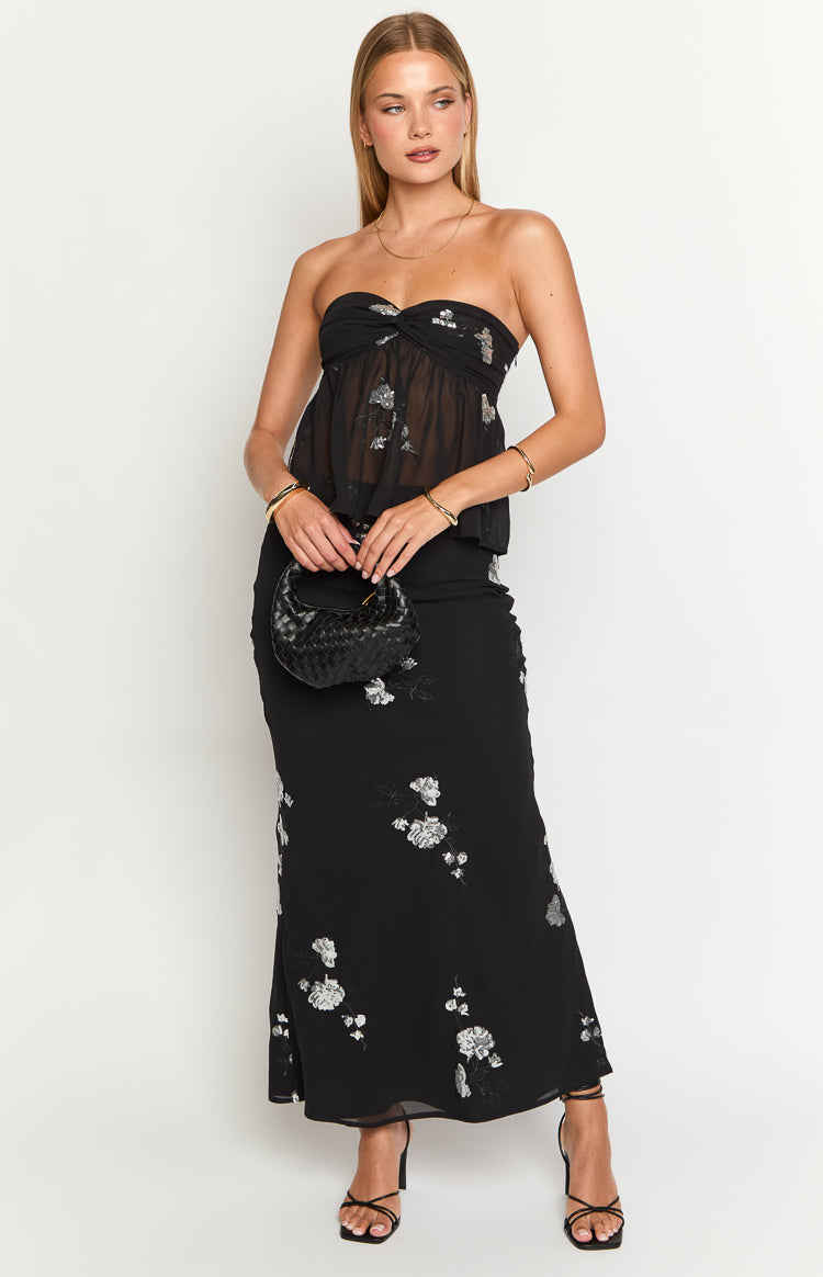 Black sheer strapless top with silver floral embroidery and a gathered bust detail, flowy fit