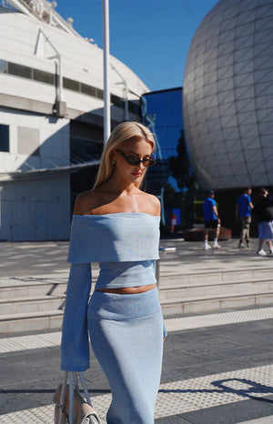Beginning Boutique Simona Blue Long Sleeve Off Shoulder Knit Top shimmery light blue off-shoulder knit top with long flared s