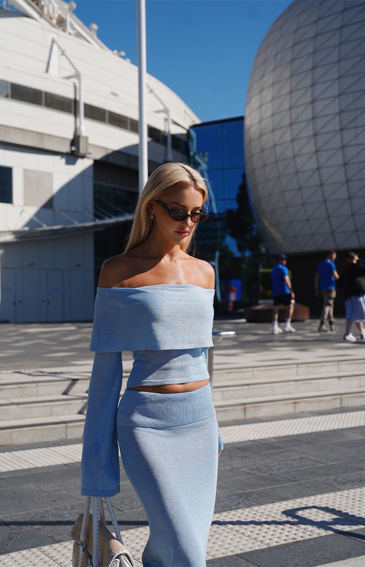 Beginning Boutique Simona Blue Long Sleeve Off Shoulder Knit Top — light blue off-shoulder knit top with long flared sleeves and a cropped fit