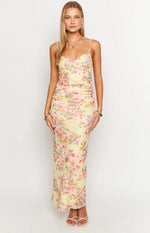 Yellow floral maxi dress with a sweetheart neckline, spaghetti straps, and a ruched fitted bodice