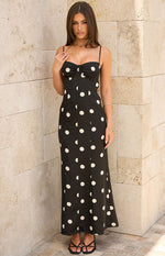 Close up of a black spot print slip dress featuring a sweetheart neckline and ruched bust cups perfect for Date Night