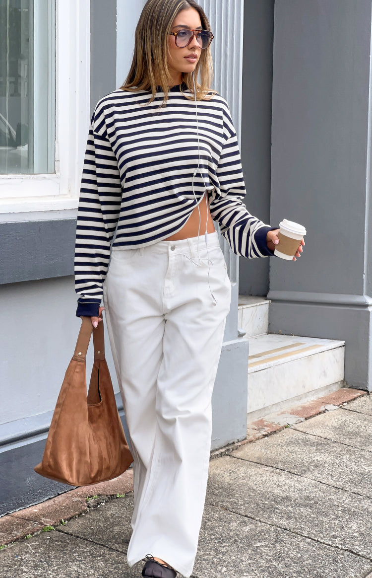 Navy and white striped long sleeve top with a crew neck, relaxed fit, and gathered side hem detail