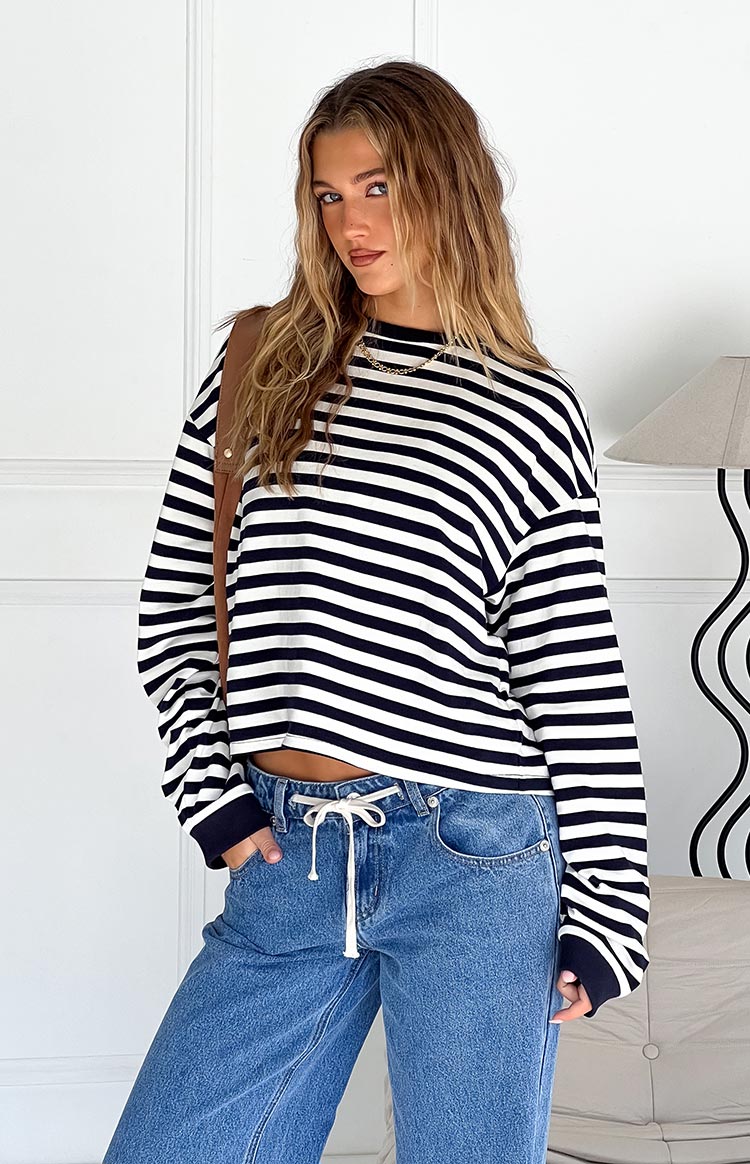 Navy and white striped long sleeve top with a mock neck and relaxed, slightly cropped fit