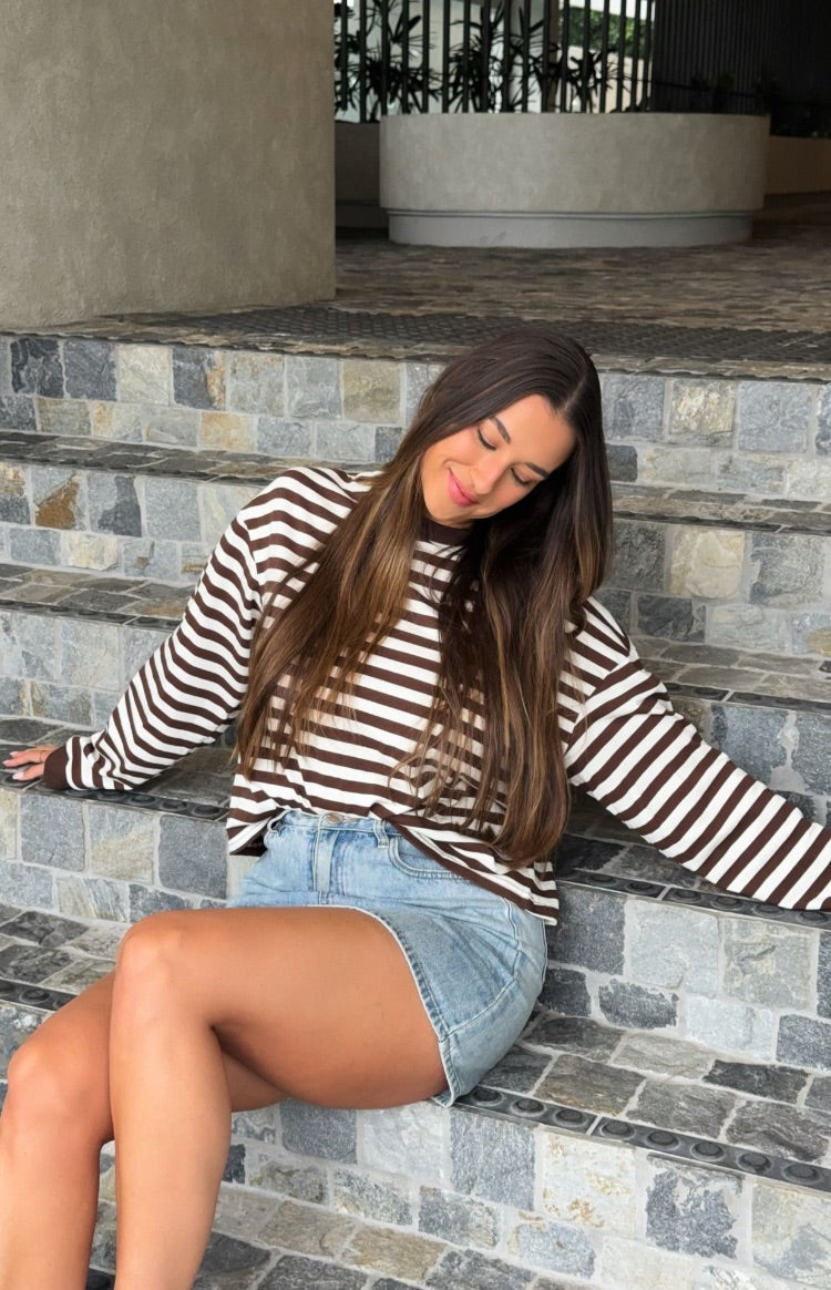 Loose fit chocolate and white stripe long sleeve top showing the relaxed sleeves and hem