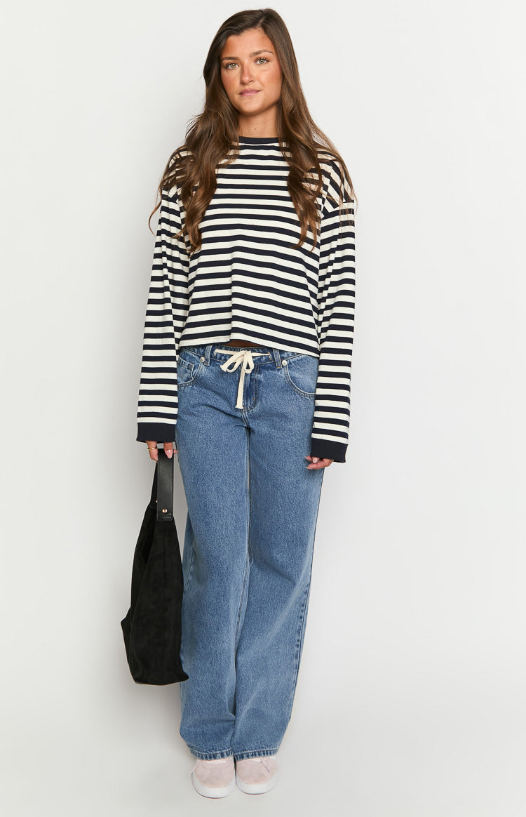 Navy and white striped long sleeve top with a relaxed fit and slightly cropped hem