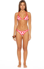 Pink and red polka dot triangle bikini top with red contrast binding, shown with matching bottoms