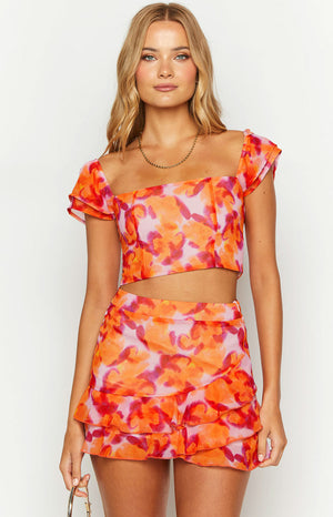 Beginning Boutique Sophia Azalea Pink Print Short Sleeve Crop Top azalea pink orange red floral print square neck fitted crop top with short flutter sleeves