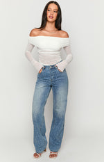 Mid wash straight leg jeans with all-over rhinestone embellishments and a high waist