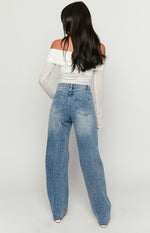 Rear view of mid wash denim straight leg jeans with scattered rhinestone embellishments