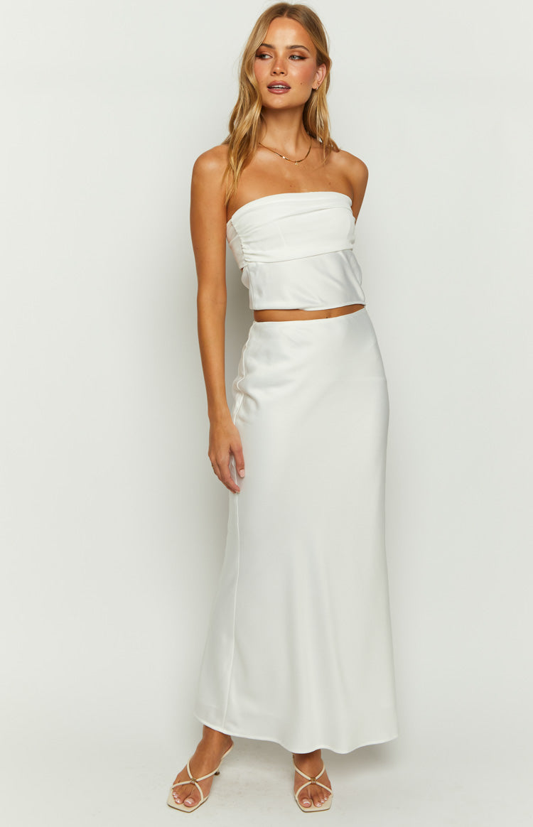 Front view of a white strapless satin crop top with a ruched bust detail and fitted silhouette
