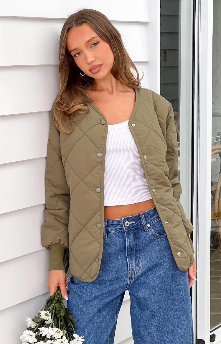Beginning Boutique Steph Khaki Quilted Bomber Jacket khaki quilted collarless bomber jacket with snap button front and ribbed cuffs