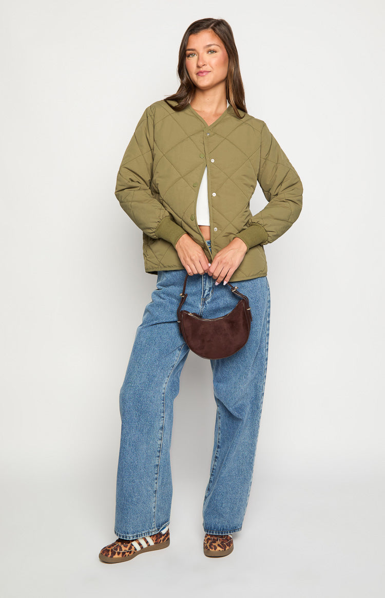 Khaki quilted bomber jacket with a V-neckline, snap button front, and ribbed cuffs