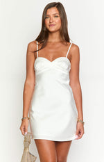 White satin mini dress with a sweetheart neckline and ruched bust detail