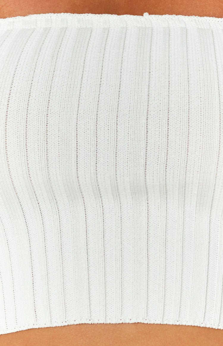 Close-up of the white knit bandeau top showing the fine vertical ribbing