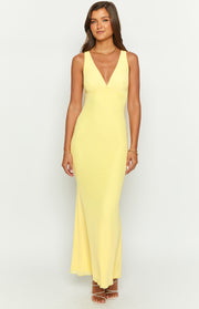 Front view of a sunflower yellow mesh maxi dress with a deep V-neck and ruched bust detail
