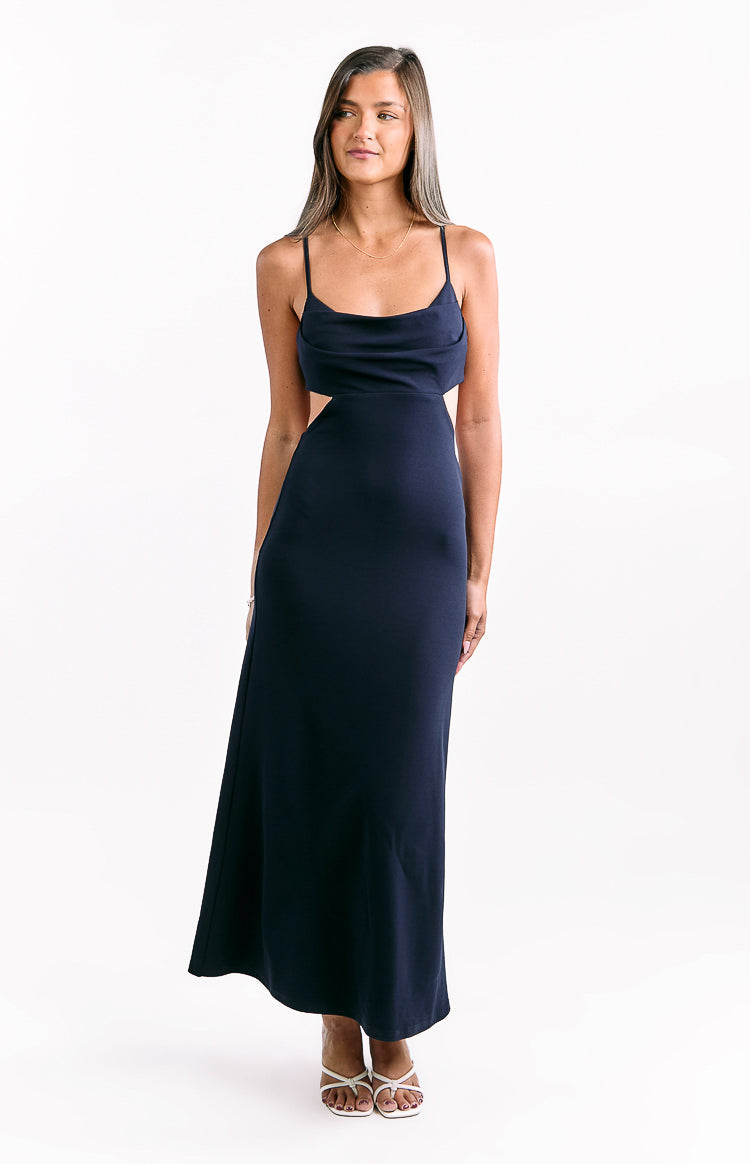 Front view of a navy crepe maxi dress with a cowl neck and side waist cutouts