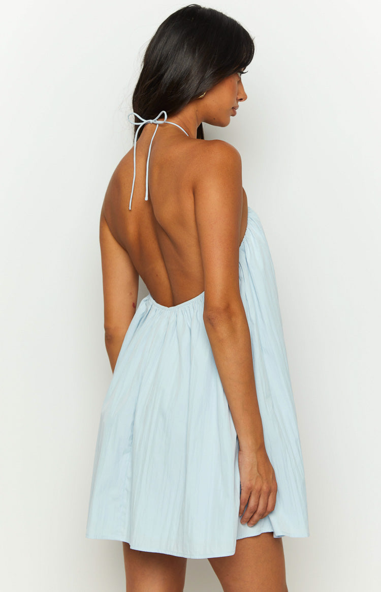 Close-up of the gathered halter neckline with thin tie straps on a light blue mini dress