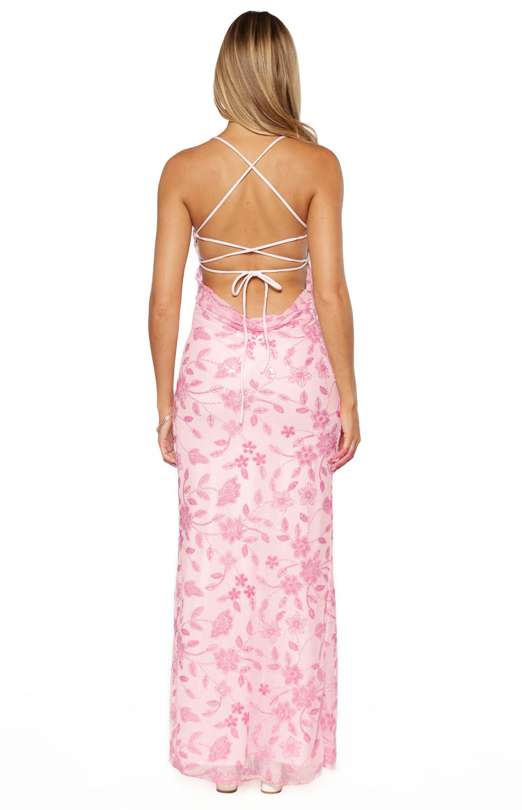 Rear view of a pink sequin maxi dress with criss-cross tie-back straps and a low scoop back