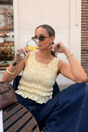 Beginning Boutique Tango Yellow Top yellow and white gingham shirred tank top with a ruffled hem