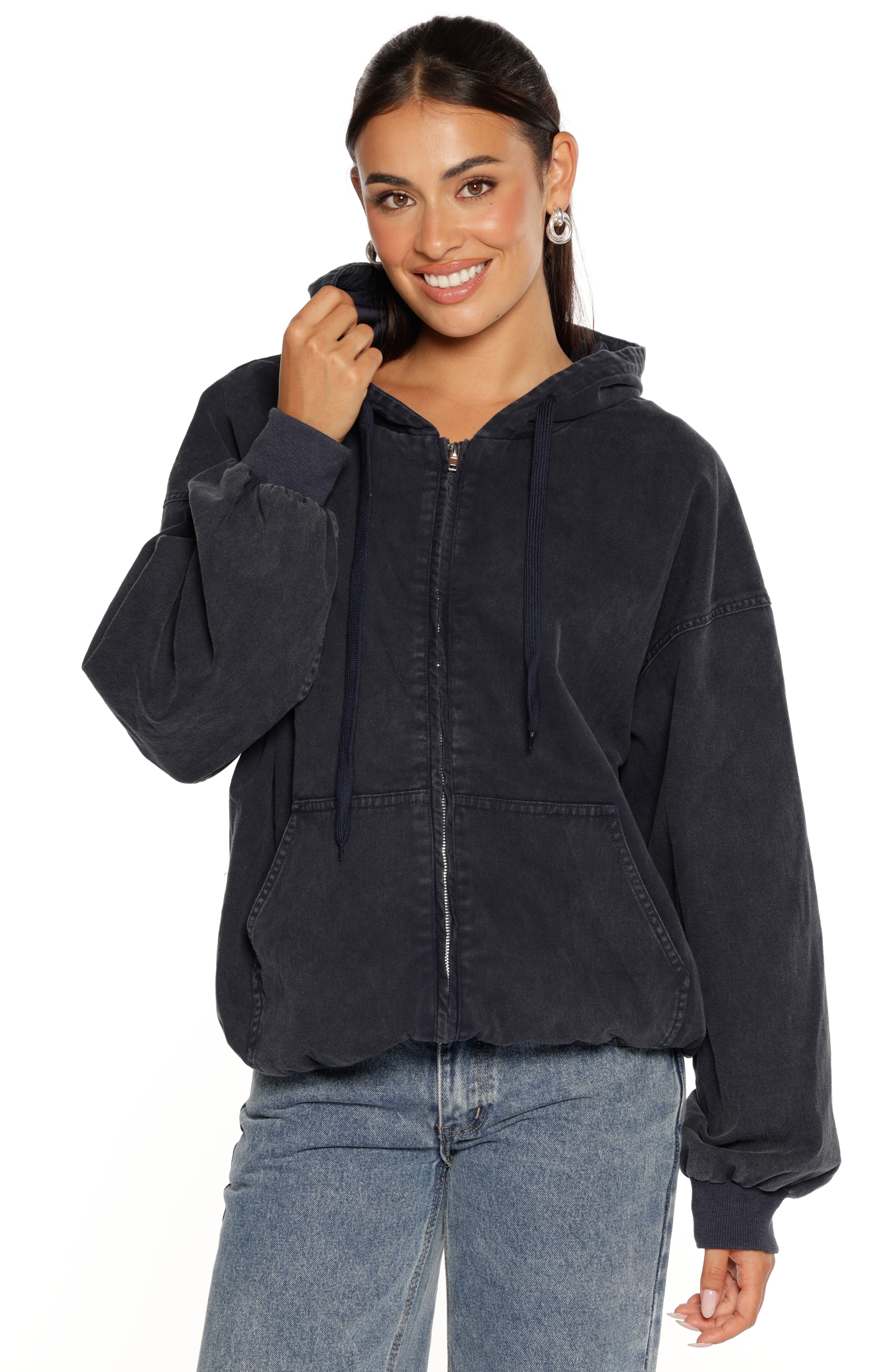 Front view of a washed navy oversized hooded jacket with full zip front, drawstrings, and kangaroo pockets