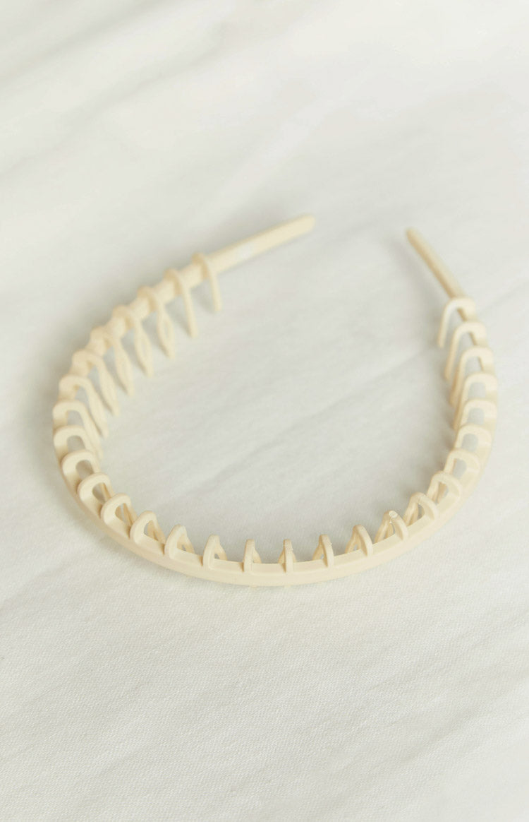 Close-up of the cream and tortoiseshell headbands showing the comb teeth detail