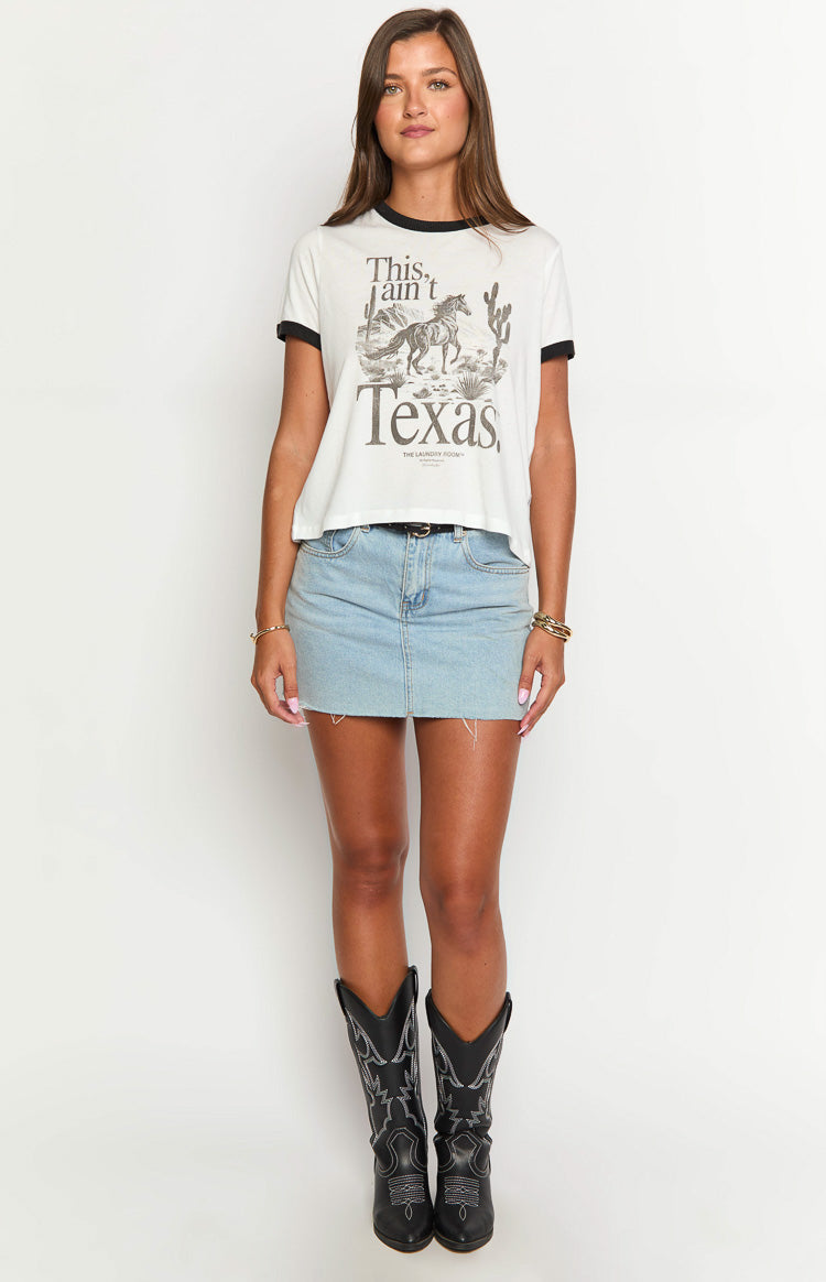 White ringer tee with black trim on the neck and sleeves, featuring a large graphic print of a horse and cacti