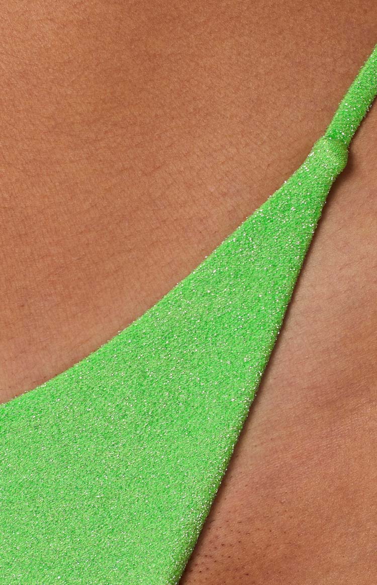 Front view of green textured high-cut bikini bottoms with thin side straps and a V-cut front