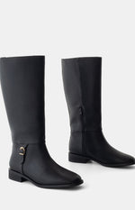 Beginning Boutique Therapy Arcade Black PU Riding Boots black knee-high riding boots with flat heel, gold buckle detail, and side zipper