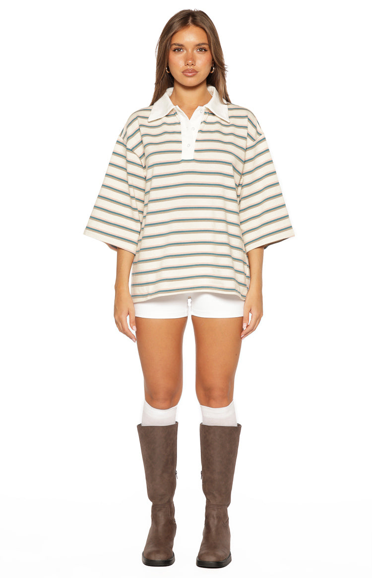 Relaxed fit cream polo shirt with green, brown, and pink horizontal stripes