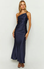 Front view of a navy satin maxi dress featuring a one-shoulder neckline and ruched detailing on the bodice