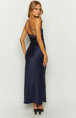 Rear-side view of a navy satin maxi dress with a single thin strap and ruched detailing on the side