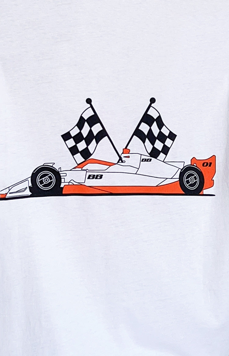 Close-up of the white and orange race car graphic with two checkered flags on a white tee