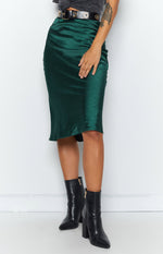 Emerald green silky midi skirt with a bias cut and gentle A-line flare at the hem