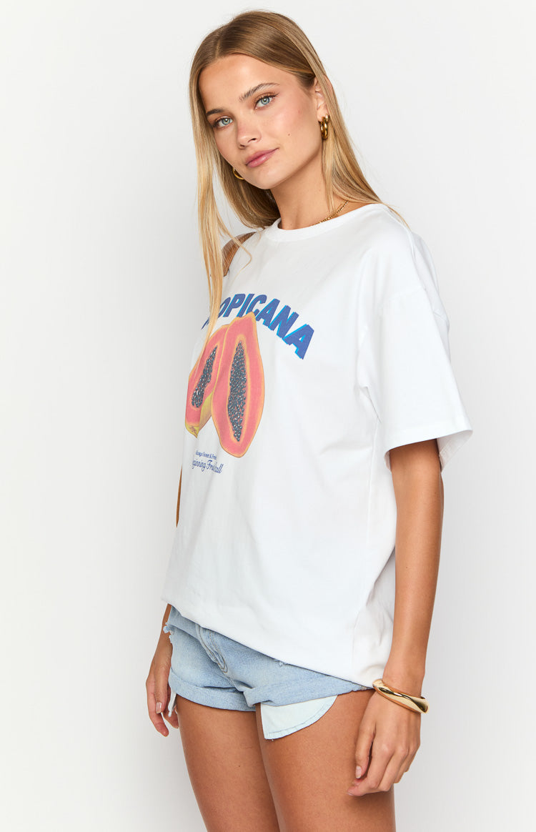 Side view of a white oversized tee with short sleeves and a blue and pink papaya graphic print