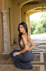 Grey cowl neck maxi dress with silver stud detailing along the side seams and halter straps