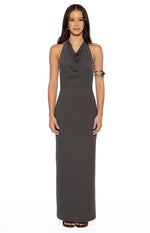 Front view of a grey bodycon maxi dress with a cowl neck and silver stud details along the halter straps